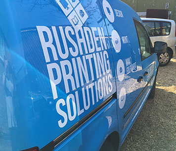 Blue Caddy with white text vinyl applied.