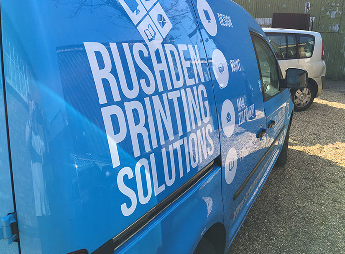 Blue Caddy with white text vinyl applied.